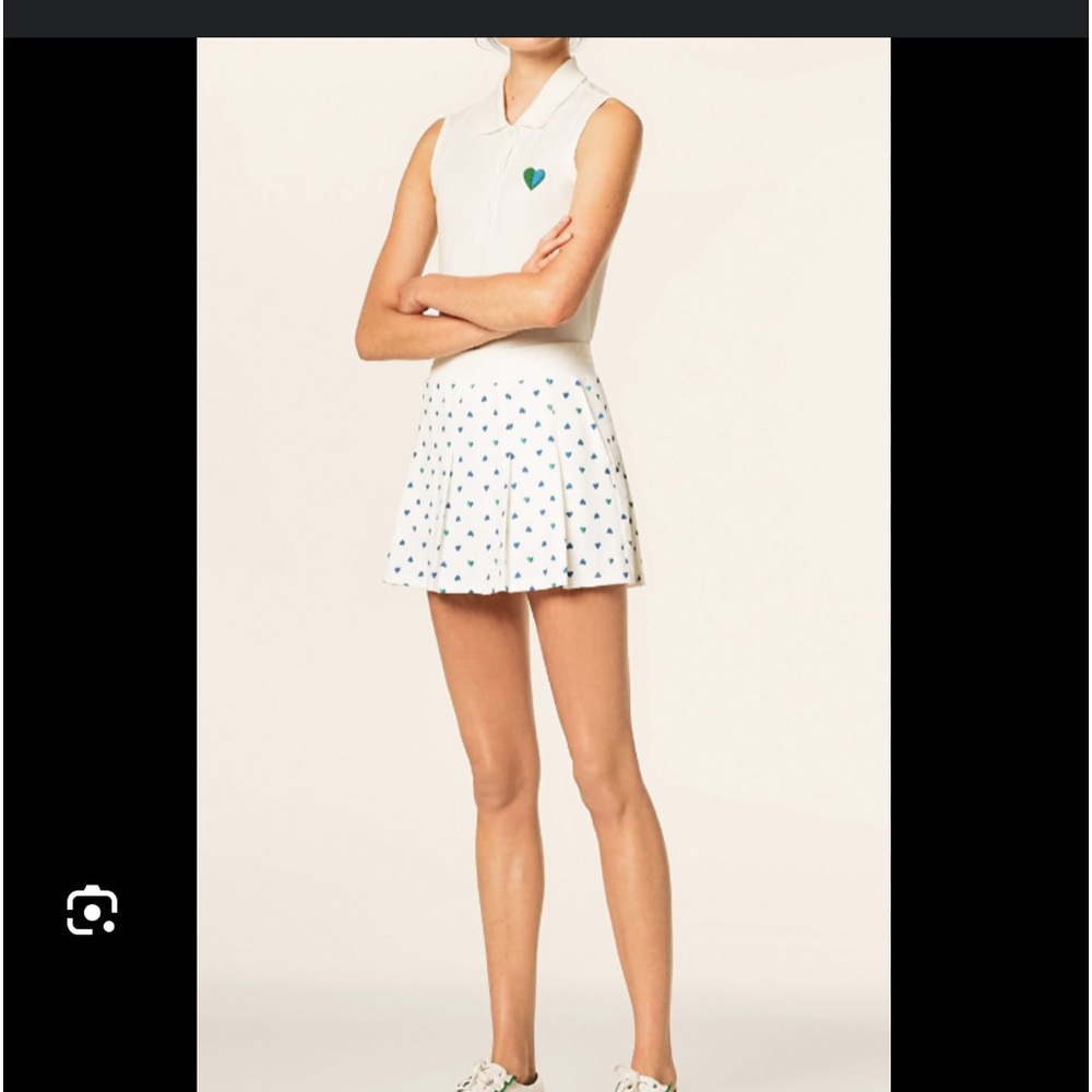 Tory Burch tennis Skirt, built in shorts with ball pockets. New without tags.